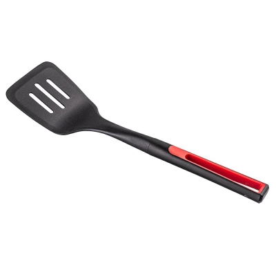 
                                            Openwork spatula with a red finish
                                            