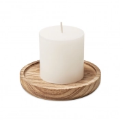 Candle on round wooden base