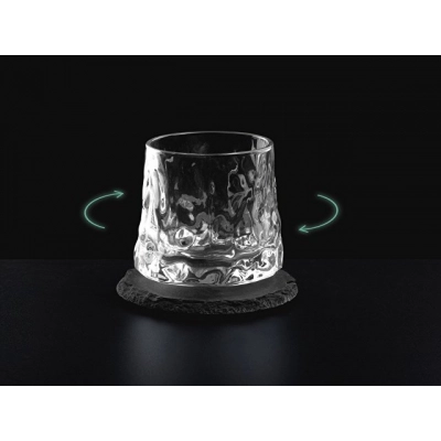 
                                                Rotating whiskey glass on a slate coaster 