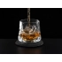 Rotating whiskey glass on a slate coaster Rotating whiskey glass on a slate coaster