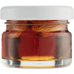 Nutree almond in rosehip syrup