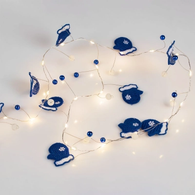 
                                                Merry Mittens blue garland.
                                                