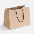 Stor paper bag, uncolored with black handles.