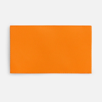 
                                                Fabric label Epsilon, M, neon orange.
                                                