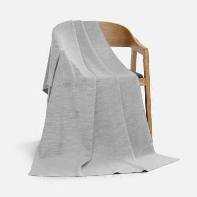 
                                                Voyage blanket in a case, light gray.
                                                