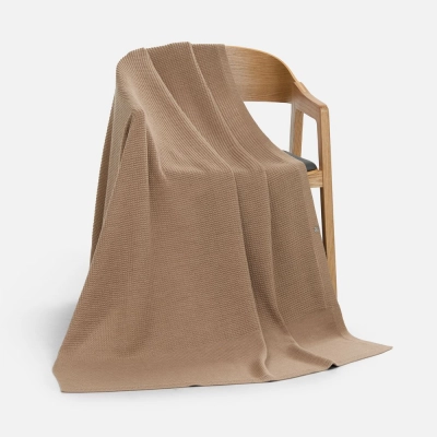 
                                                Voyage blanket in a beige case.
                                                