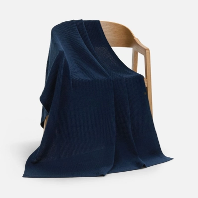 
                                                Voyage blanket in a blue case.
                                                