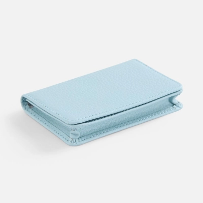 
                                                Blue Unison business card holder.
                                                
